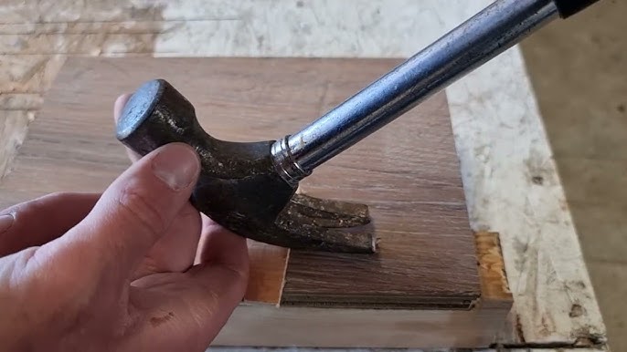 An Image showing using Claw Hammer Lever Method to remove a stripped screw